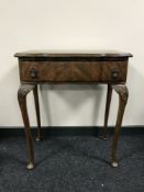 A mahogany cutlery table on Queen Anne style legs