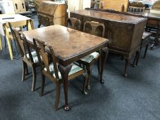 A six piece walnut Queen Anne style dining room suite comprising of sideboard,