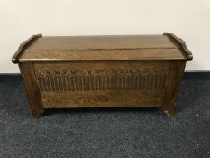 A carved oak blanket box
