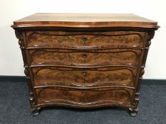 A French mahogany serpentine fronted four drawer chest