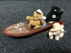 A Steiff Cris Craft motorboat set with additional black Steiff bear