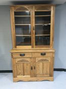 An Edwardian oak glazed door bookcase