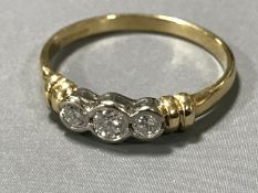 An 18ct gold three stone diamond ring, total diamond weight estimated at 0.