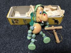 A boxed Pelham puppet - Baby Dragon