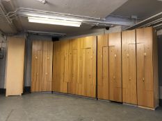 A twelve section light oak locker unit CONDITION REPORT: All open but there are no