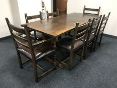 A Siesta oak refectory dining table and eight dining chairs