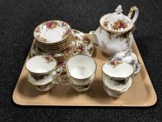 A tray of twenty one piece Royal Albert Country Roses tea set together with a Royal Albert