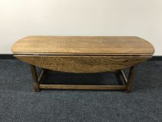 An oak refectory drop leaf coffee table
