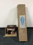A cased Singer sewing machine,