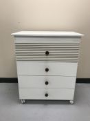 A Micuna four drawer chest