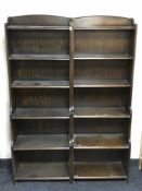 Two sets of narrow oak shelves