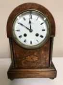 An early twentieth century inlaid oak dome topped mantel clock with enamel dial retailed by Reids