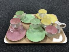 Six Maling lustre tea cups and tea plates together with a Maling miniature floral pattern jug