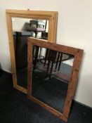 A pine framed mirror together with one other mirror