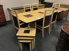 A contemporary high gloss nine piece dining room suite : extending table, six chairs,