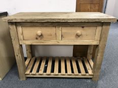 A reclaimed pine two drawer side table,