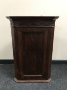 A late 20th century mahogany hanging corner cupboard