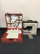 A cased vintage Elna sewing machine together with a Brexton picnic set