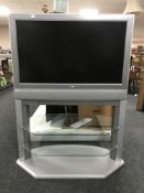 A Toshiba 32 inch lcd tv on stand with remote