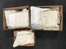 Three boxes of vintage night dresses, shirts, cushion covers, linens etc.