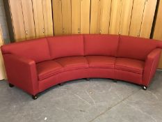A continental curved settee upholstered in red fabric