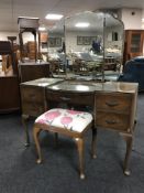 A walnut Queen Anne style dressing table with triple mirror and stool