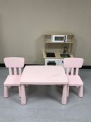 A pink plastic child's table,
