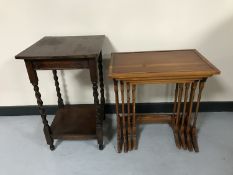 An oak occasional table and a nest of three yew wood tables