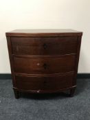 A mahogany three drawer bowfronted chest