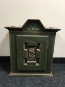 An antique pine hand painted hanging cabinet