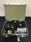 An aluminium camera case containing Olympus camera,