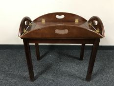 A mahogany butler's tray on stand