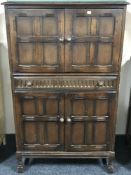 A twentieth century oak cocktail cabinet