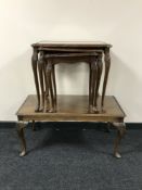 A mahogany coffee table and matching nest of three tables