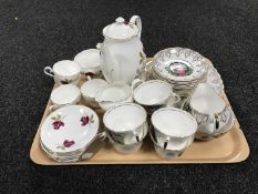 A tray containing an Harleigh bone china tea service, together with an Argyle china tea service,