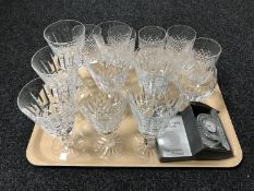 A tray of Waterford crystal glasses and a boxed Waterford desk clock.
