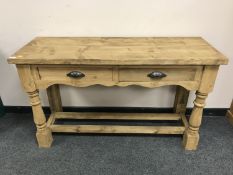 A reclaimed pine two drawer Victorian style table,