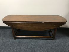 A mahogany refectory drop leaf coffee table