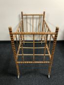 A mid twentieth century bamboo framed child's cot, length 94 cm.