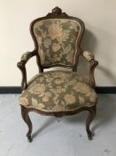 A French walnut armchair with floral fabric