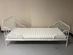 A 3' white metal day bed with mattress