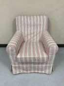 An armchair in a loose striped cover