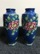 A pair of Maling blue vases with peony rose decoration,