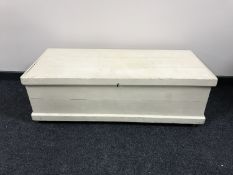 A painted antique pine blanket box