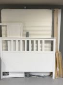 A white Ikea 4'6 bed frame with mattress