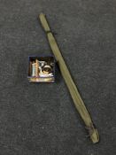 A two piece sea fishing rod in carry bag together with a box of Daiwa 7600 fishing reel, line,