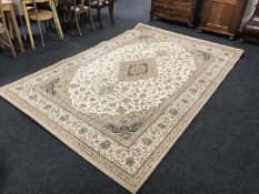 A contemporary floral woollen rug on cream ground