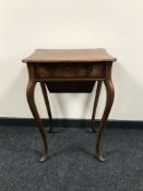 A mahogany sewing table