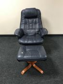 A blue leather swivel armchair with matching footstool