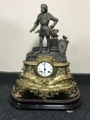 A French brass and spelter mantel clock with enamelled dial on wooden plinth